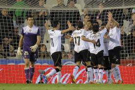 Valencia's players celebrate after scori