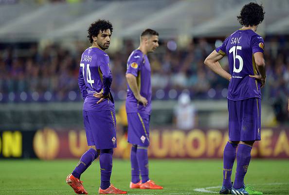 Fiorentina's Egyptian forward Mohamed Salah Ghaly  (L) reacts with teammates   during the UEFA Europa League second leg semi-final football match Fiorentina vs Sevilla at the Artemio Franchi Stadium in Florence on May 14, 2015. AFP PHOTO / FILIPPO MONTEFORTE        (Photo credit should read FILIPPO MONTEFORTE/AFP/Getty Images)