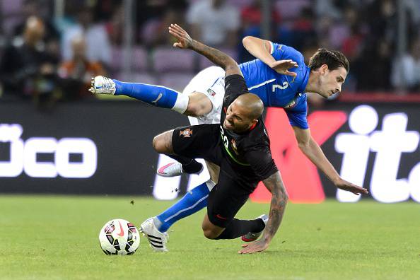Italy's defender Mattia De Sciglio (up) vies with Portugal's midfielder Ricardo Quaresma during the friendly game Portugal against Italy on the Stade de Geneve on June 16, 2015 in Geneva.  AFP PHOTO / FABRICE COFFRINI        (Photo credit should read FABRICE COFFRINI/AFP/Getty Images)