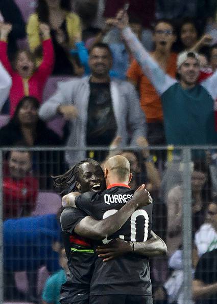 Portugal's forward Eder (L) celebrates with his teammate Portugal's midfielder Ricardo Quaresma after he scored the team's first goal during the friendly game Portugal against Italy at the Stade de Geneve on June 16, 2015 in Geneva.  AFP PHOTO / FABRICE COFFRINI        (Photo credit should read FABRICE COFFRINI/AFP/Getty Images)