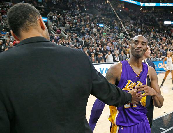 SAN ANTONIO,TX - FEBRUARY 6: Kobe Bryant #24 of the Los Angeles Lakers says his goodbye to Tim Duncan #21 of the San Antonio Spurs at the end of the game at AT&T Center on February 6, 2016 in San Antonio, Texas. . NOTE TO USER: User expressly acknowledges and agrees that , by downloading and or using this photograph, User is consenting to the terms and conditions of the Getty Images License Agreement. (Photo by Ronald Cortes/Getty Images)