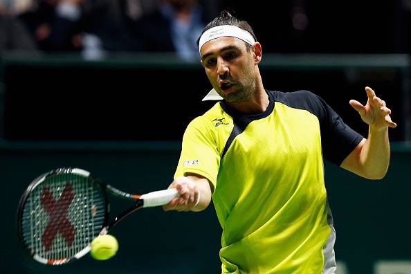 ROTTERDAM, NETHERLANDS - FEBRUARY 11: Marcos Baghdatis of Cyprus in action against Martin Klizan of Slovakia during day 4 of the ABN AMRO World Tennis Tournament held at Ahoy Rotterdam on February 11, 2016 in Rotterdam, Netherlands. (Photo by Dean Mouhtaropoulos/Getty Images)