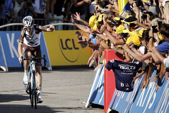 France's Romain Bardet rides past supporters ahead of the finish line at the end of the 186,5 km eighteenth stage of the 102nd edition of the Tour de France cycling race on July 23, 2015, between Gap and Saint-Jean-de-Maurienne, French Alps. AFP PHOTO / KENZO TRIBOUILLARD (Photo credit should read KENZO TRIBOUILLARD/AFP/Getty Images)