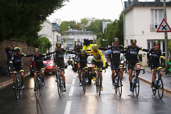 PARIS, FRANCE - JULY 26: Chris Froome (yellow) of Great Britain and Team Sky celebrates his overall victory with team mates during the twenty first stage of the 2015 Tour de France, a 109.5 km stage between Sevres and Paris Champs-Elysees, on July 26, 2015 in Paris, France. (Photo by Bryn Lennon/Getty Images)