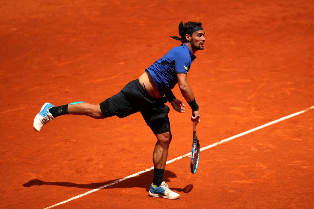 MADRID, SPAIN - MAY 07: Fabio Fognini of Italy serves in his match against Kyle Edmund of Great Britain during day four of the Mutua Madrid Open at La Caja Magica on May 07, 2019 in Madrid, Spain. (Photo by Alex Pantling/Getty Images)